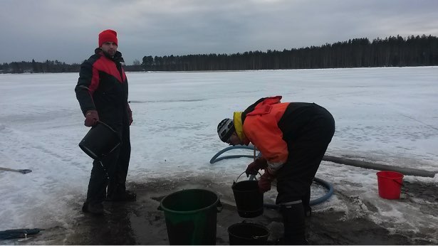 Taking chironomid core samples from a frozen lake with mining-derived pollution (photo by K. Väänänen